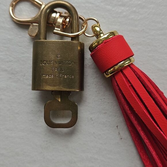 LOUIS VUITTON Red Tassel Keychain with Gold Accents - Picture 2 of 4